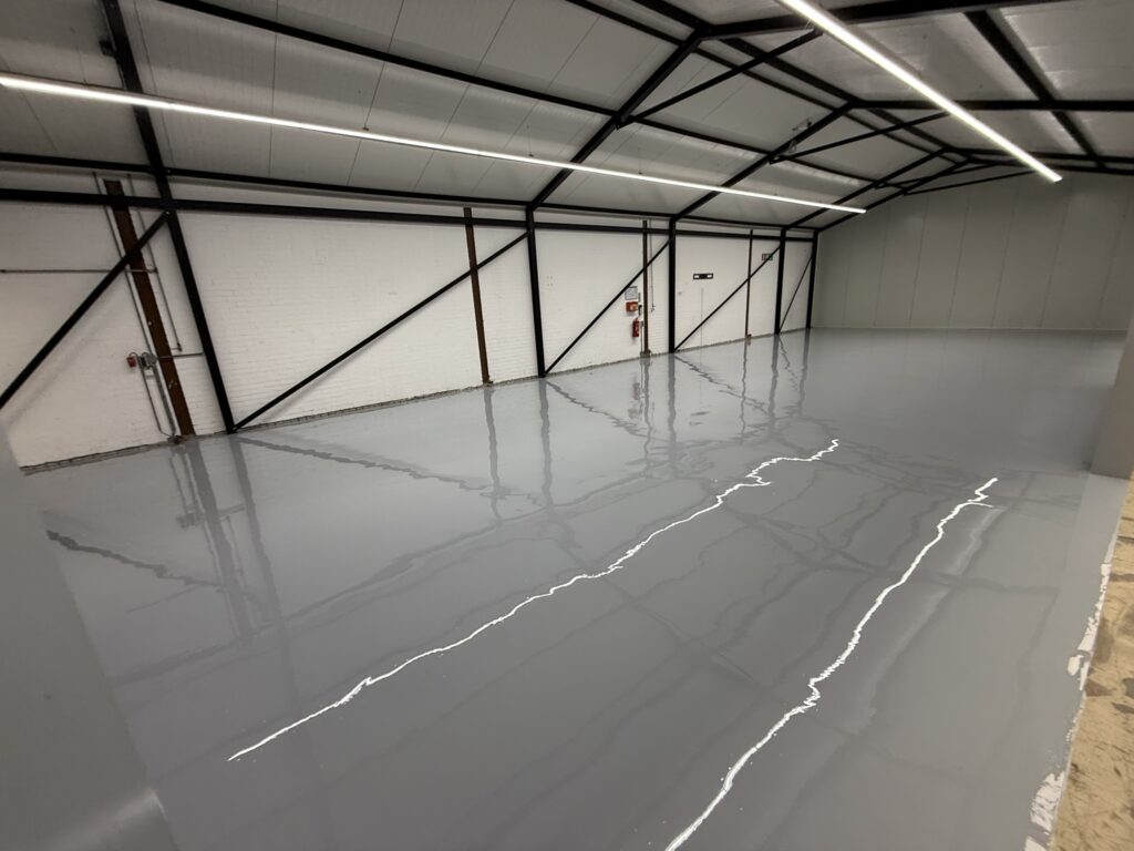 Nieuwe PMMA vloer printruimte industrie Van Straaten Schiphol